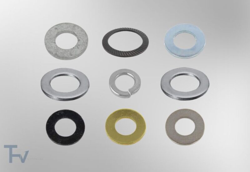 An assortment of industrial washers from THV Fasteners, including flat washers, spring lock washers, and serrated washers in various materials and finishes.