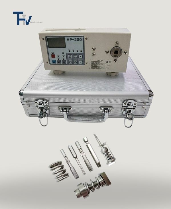 A high-precision HP-200 torque testing machine with various bit adapters and components from THV Fasteners' quality control lab.