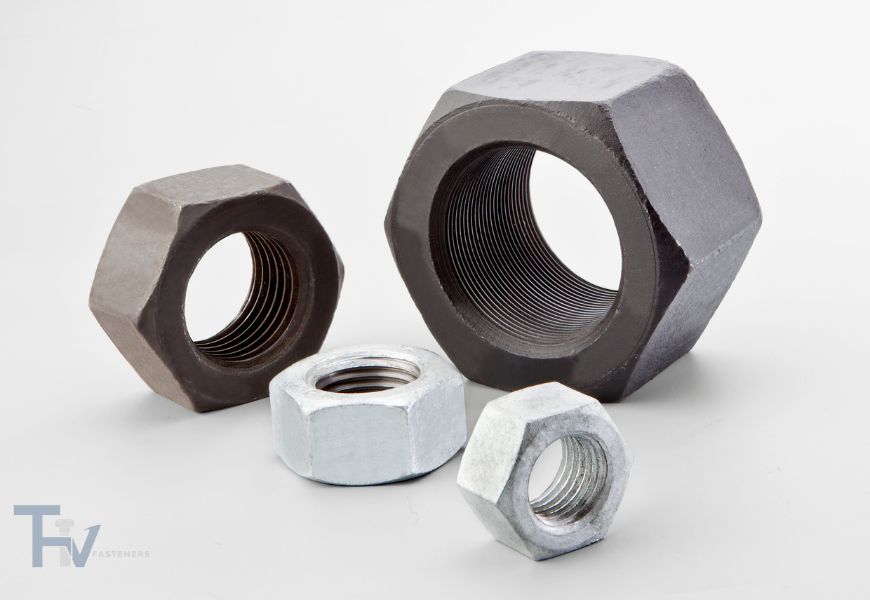 A collection of high-quality industrial nuts from THV Fasteners, showcasing a variety of types including hex nuts, nylon insert lock nuts, and cap nuts in different sizes and finishes.
