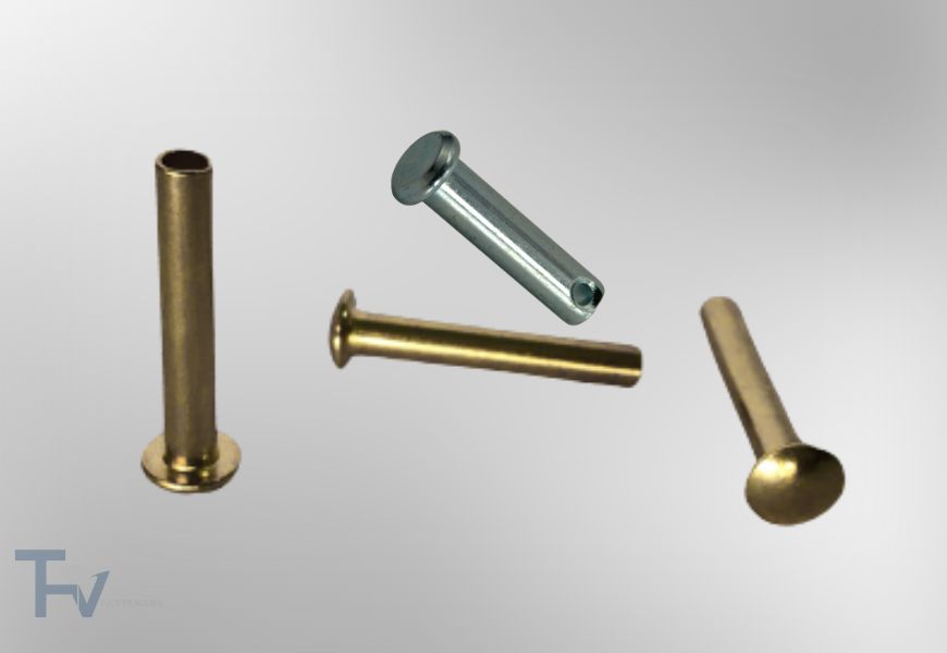 Bức ảnh này thể hiện một bộ sưu tập các loại đinh tán (rivets) và chốt (pins) công nghiệp, được sắp xếp một cách nghệ thuật trên nền tối.