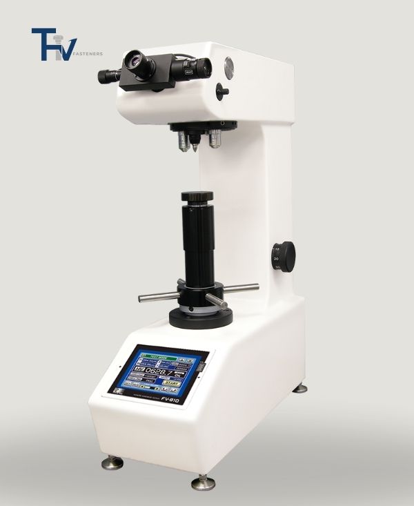 A high-precision Vickers hardness tester from THV Fasteners' lab, featuring a digital interface for accurate measurement of material hardness in fasteners.
