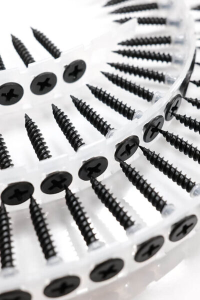 Close-up of black phosphate drywall screws with bugle head manufactured by THV Fasteners Vietnam
