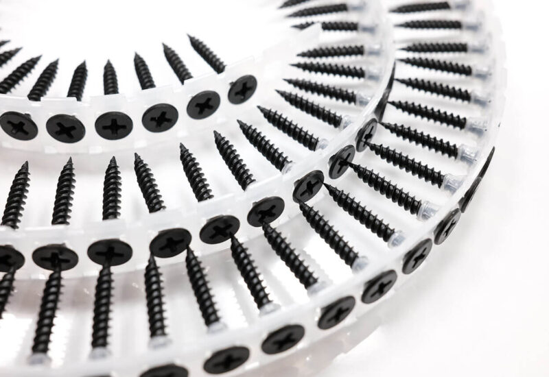 Close-up of black phosphate drywall screws with bugle head manufactured by THV Fasteners Vietnam